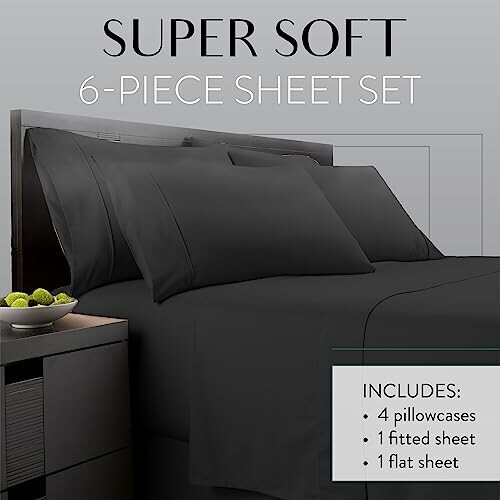 Black 6-piece sheet set on bed with two pillows