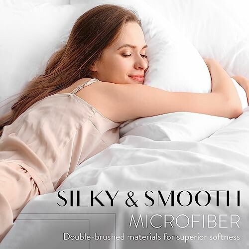 Woman smiling and relaxing on silky smooth microfiber bedding.